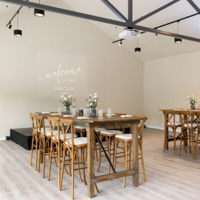 Wooden bridge table with cross back stool