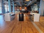 Black and white milano tall bridge tables with kube stools in Guinness