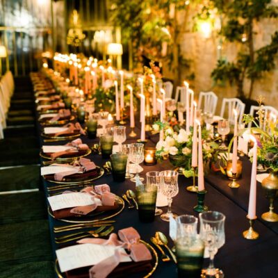 Gold cutlery and gold rim charger plates table setting